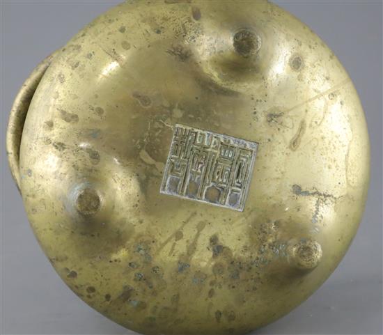 A large Chinese bronze tripod censer, Ding, Xuande four character seal mark, probably 18th / 19th century, W.25.5cm Diam. of rim 21.4cm